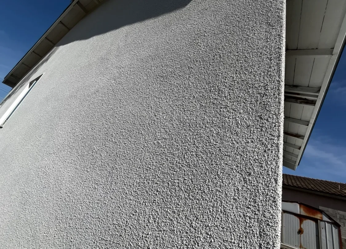 Finished exterior stucco texture at a corner